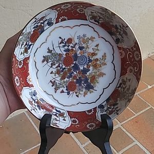 Decorative Japanese plate with a wood stand